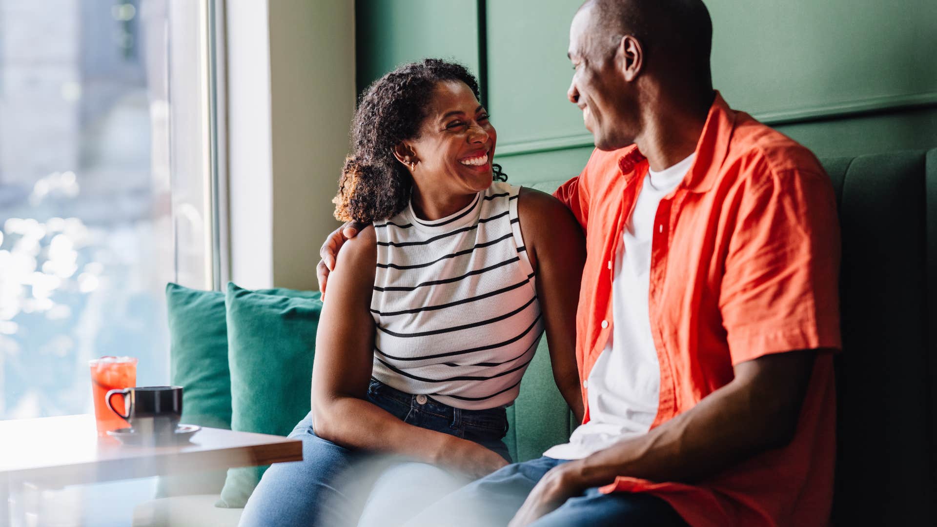 husband and wife sitting together at coffee shop