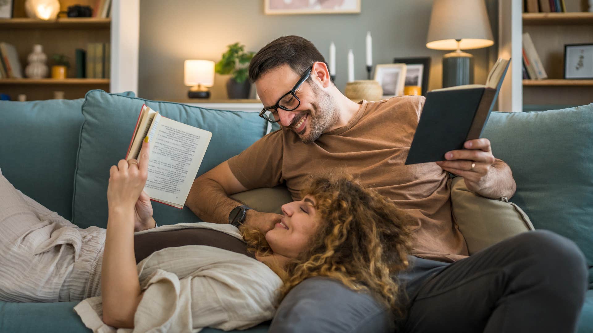 married couple reading on couch together