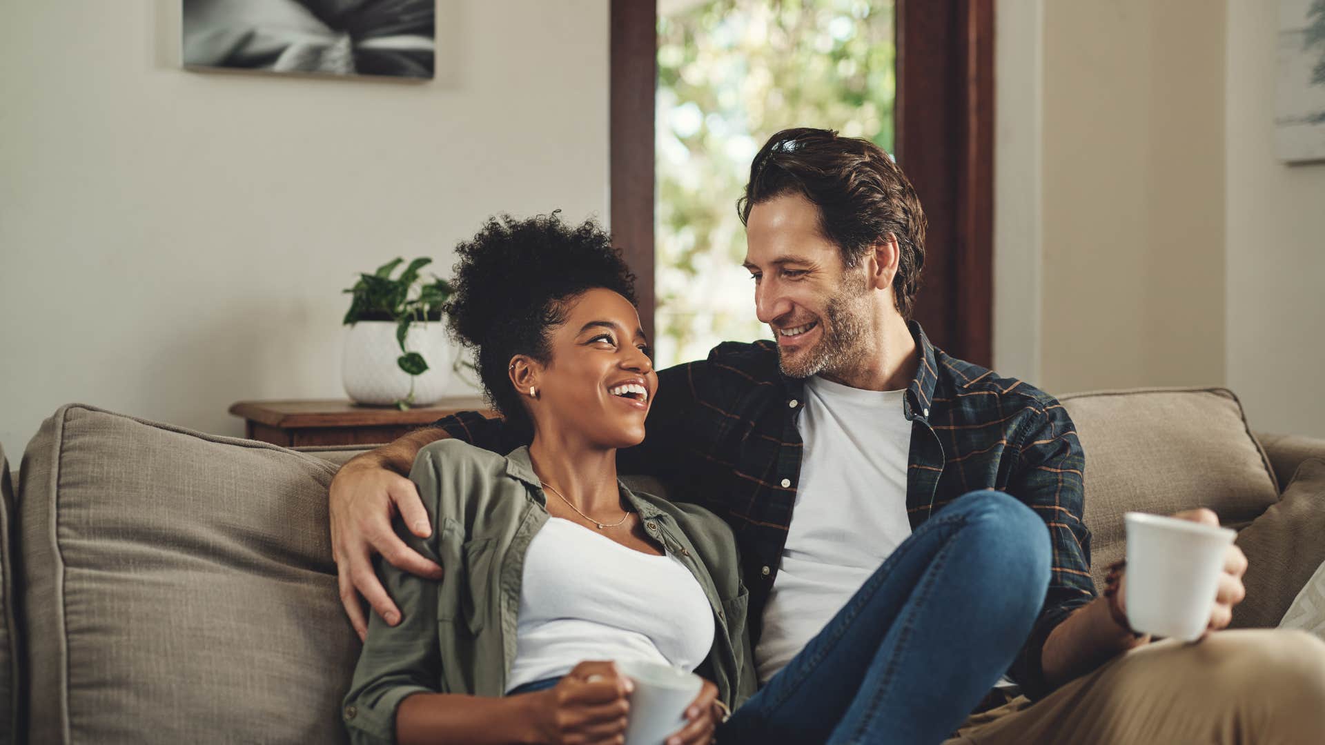 husband and wife laughing together