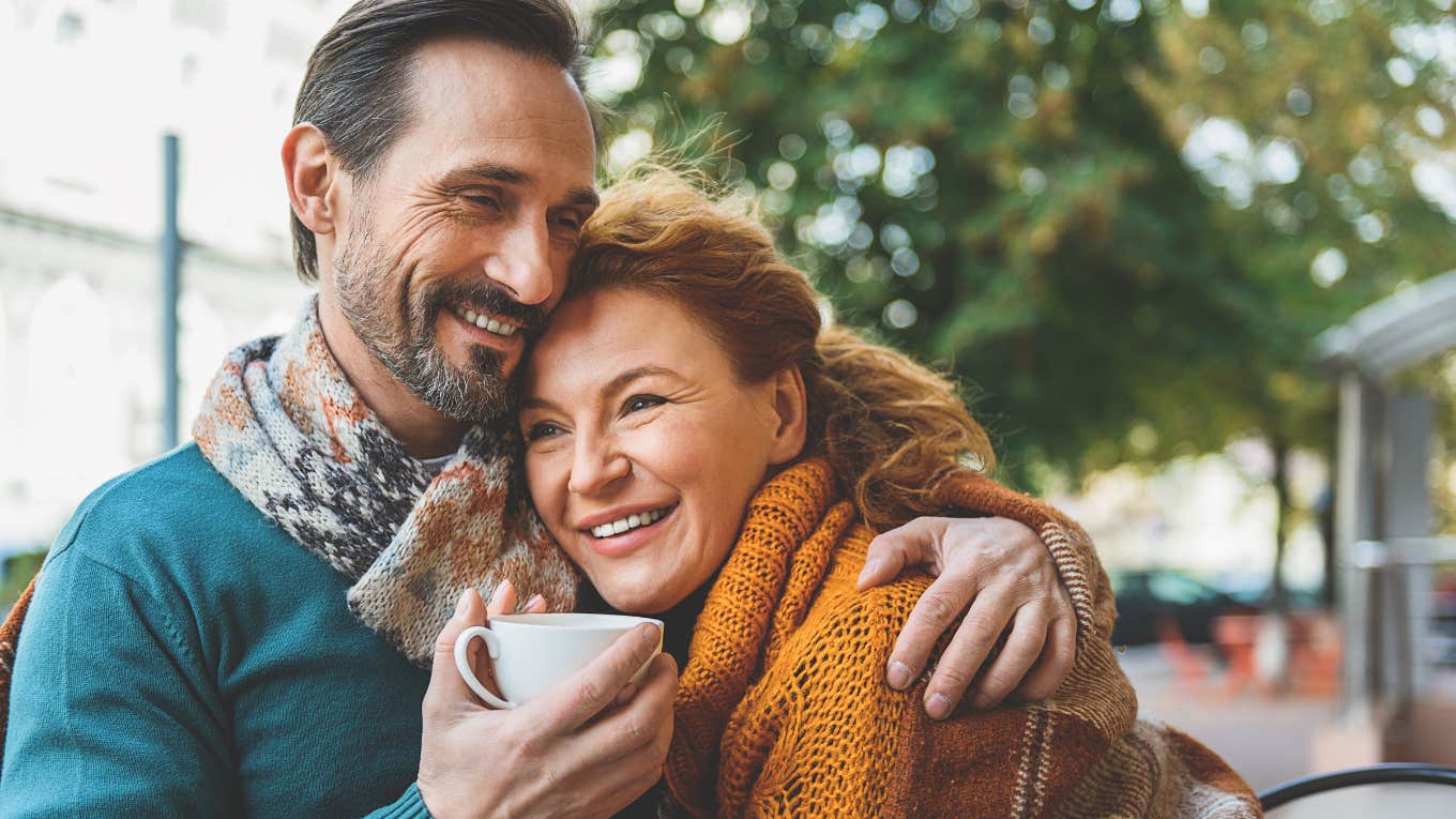 happy man sitting next to wife smiling