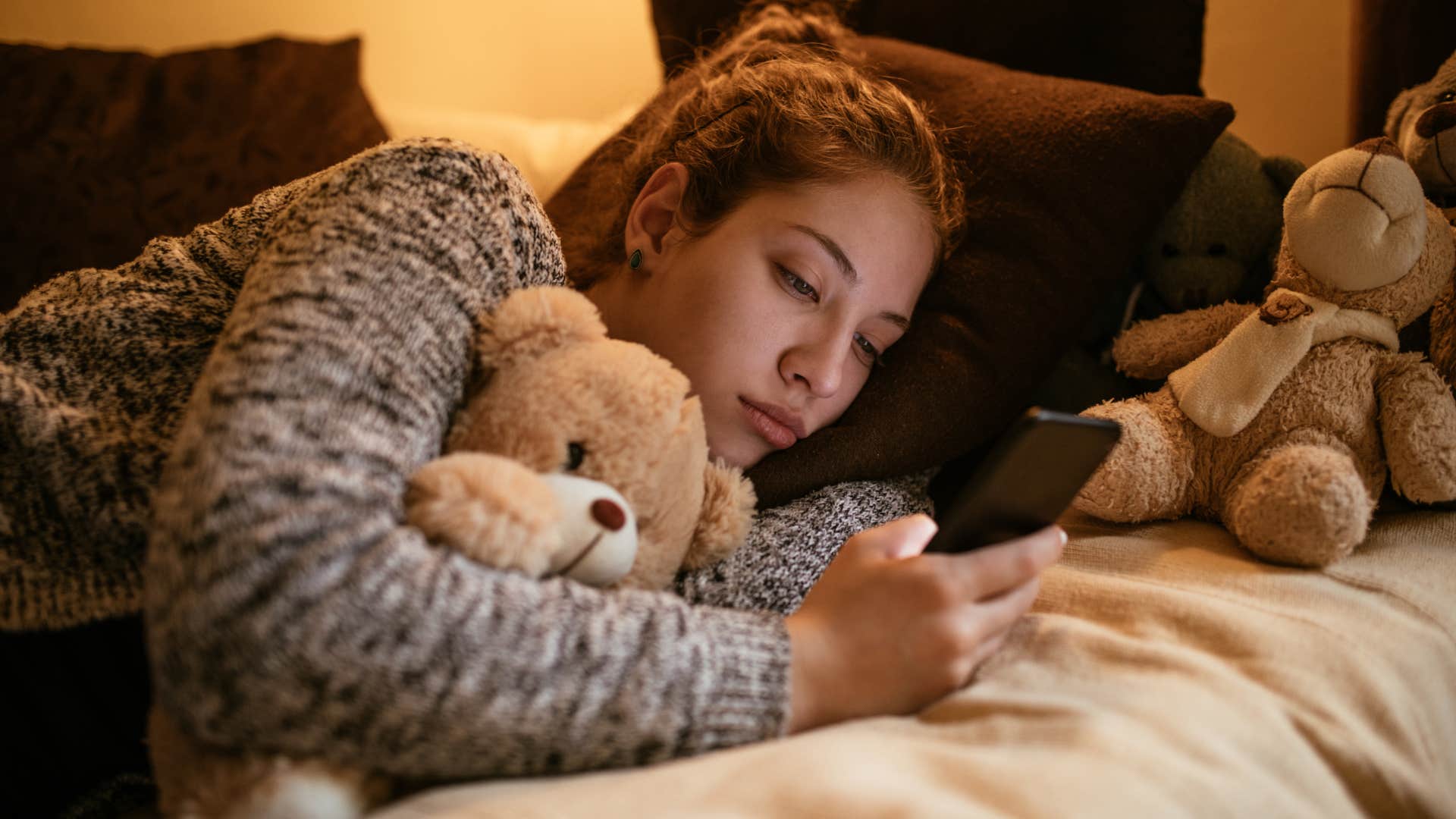 adult woman snuggling with teddy bear