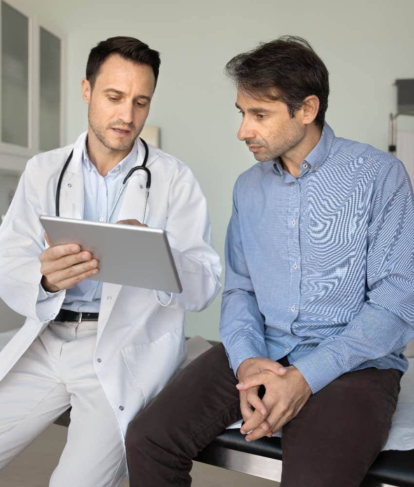 man using health insurance plan at doctor's appointment