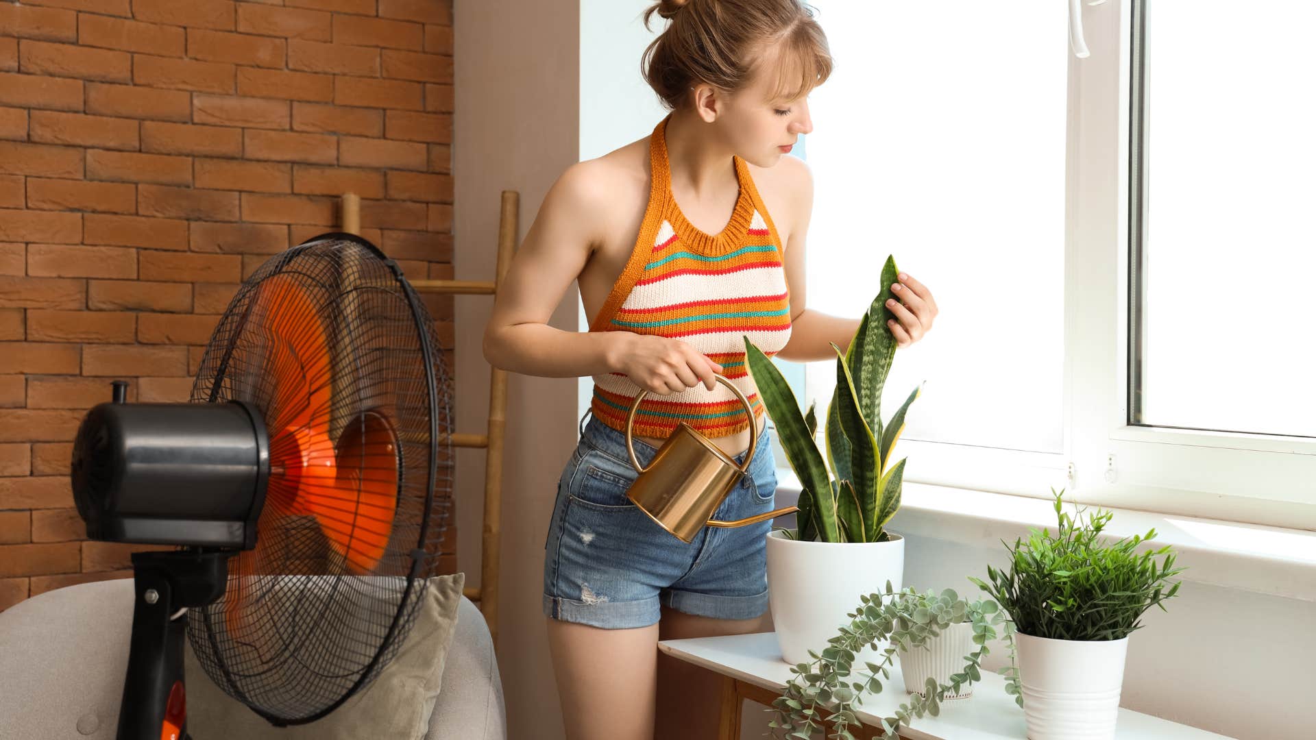 woman filling her home with plants as it's good for skin