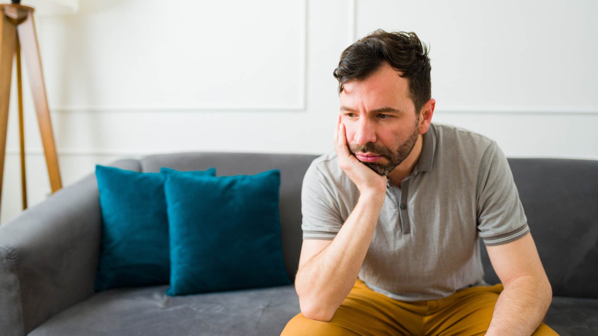upset man sitting alone wondering why his wife doesnt talk to him