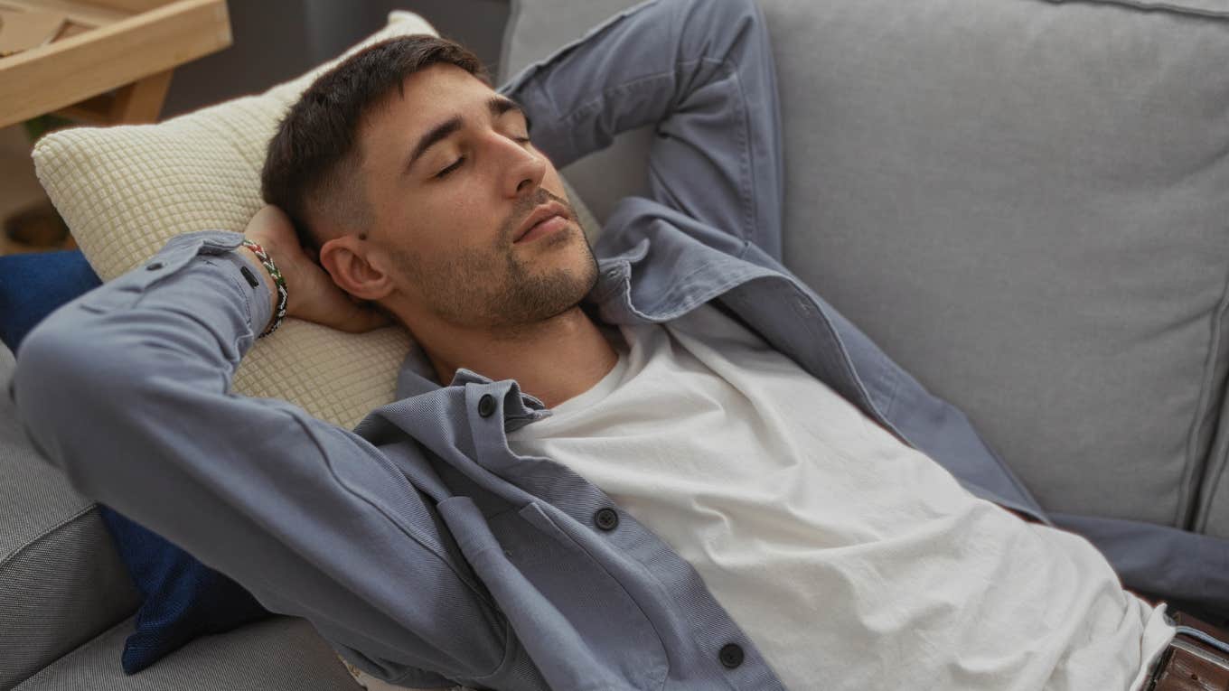 man sleeping on the couch by choice