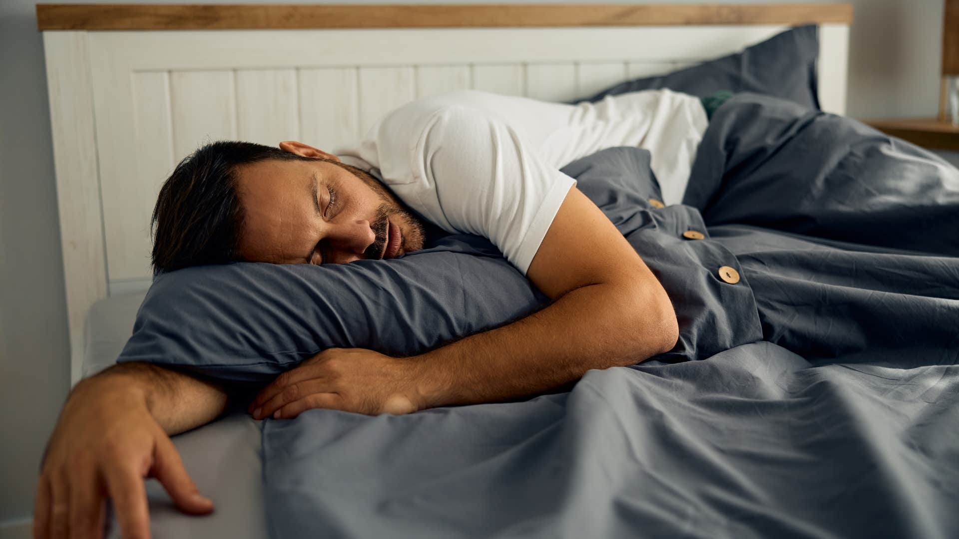 relieved man sleeping in bed
