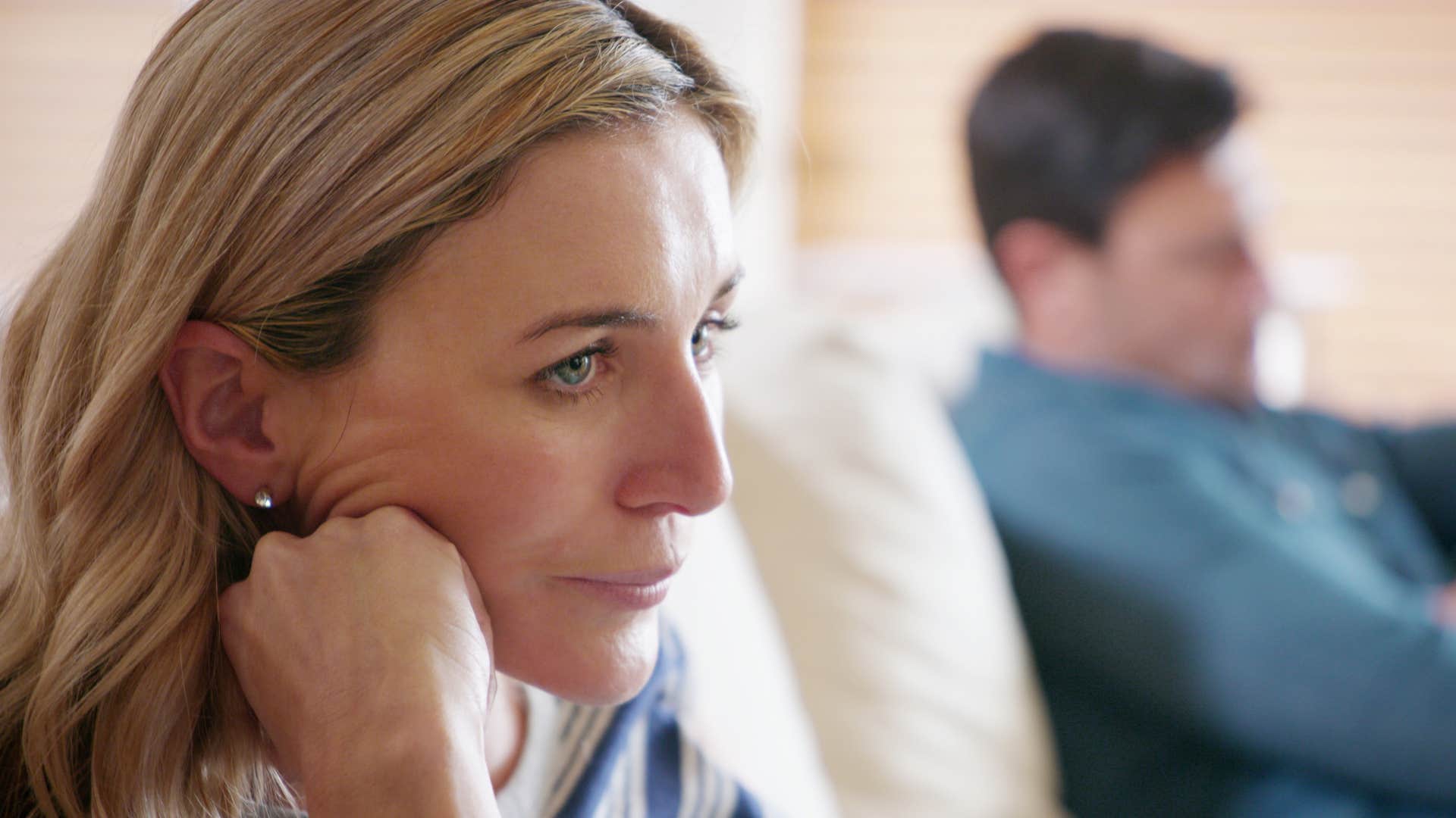 sad woman who feels like roommates with her husband