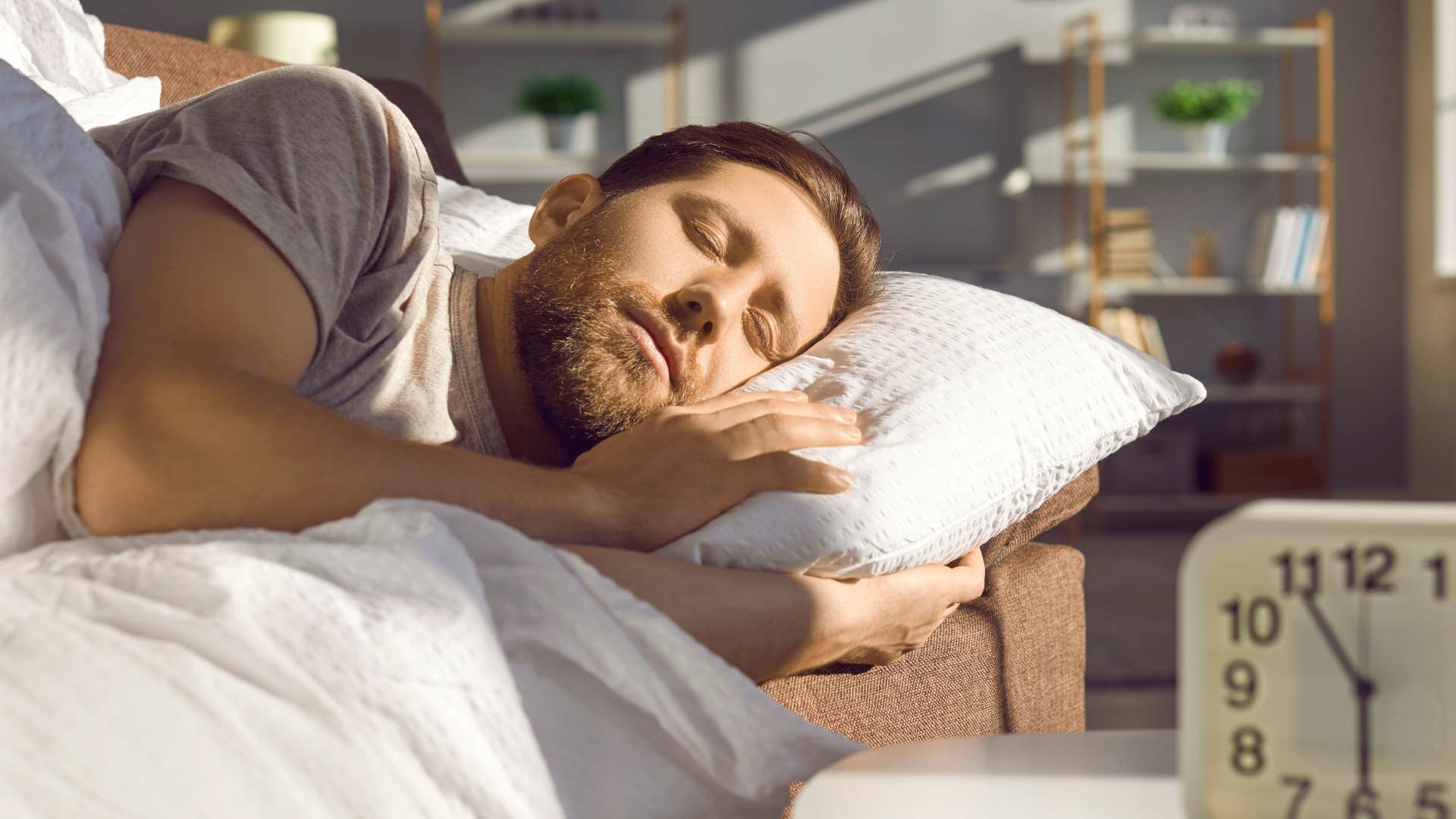 man who's avoiding something sleeping on the couch alone