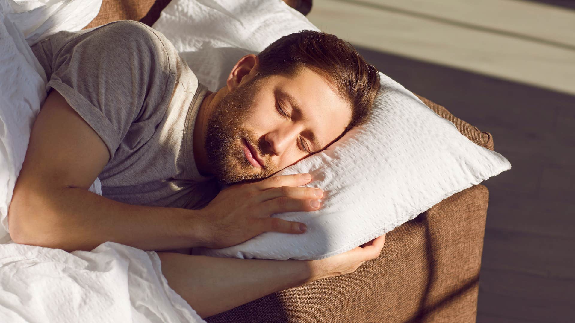 man who struggles to stay asleep on the couch