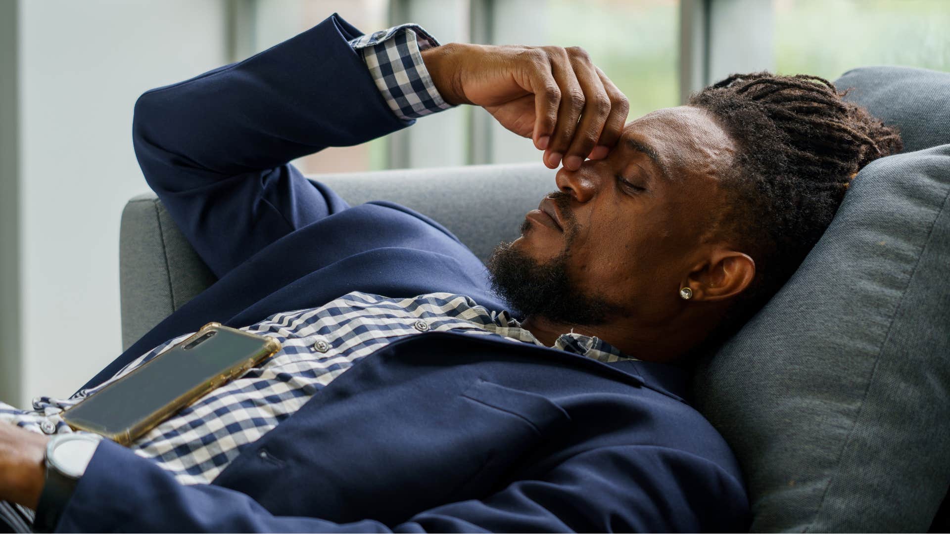 stressed man thinking about unresolved tension in his relationship