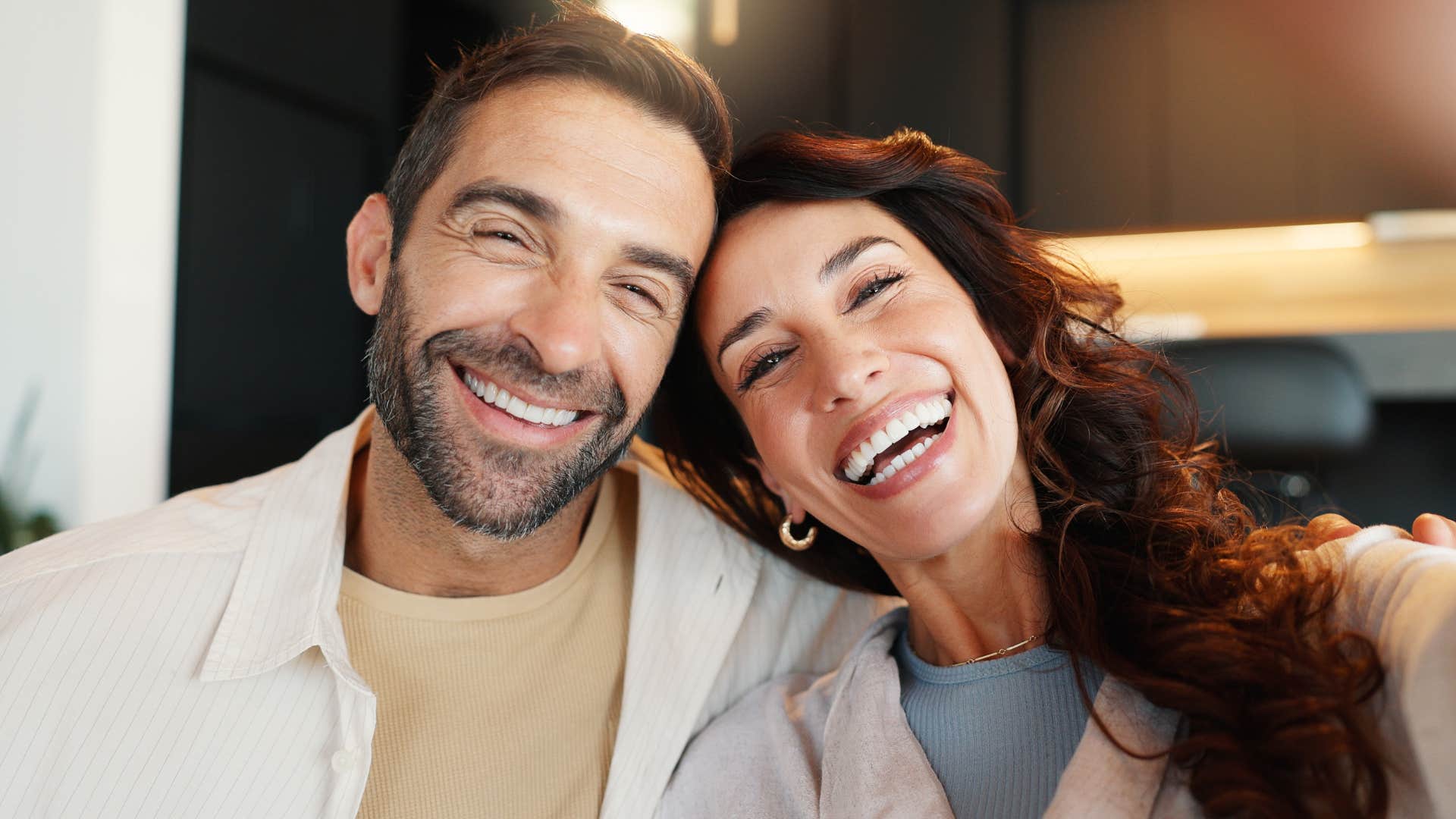 man who grows without begging smiling with partner