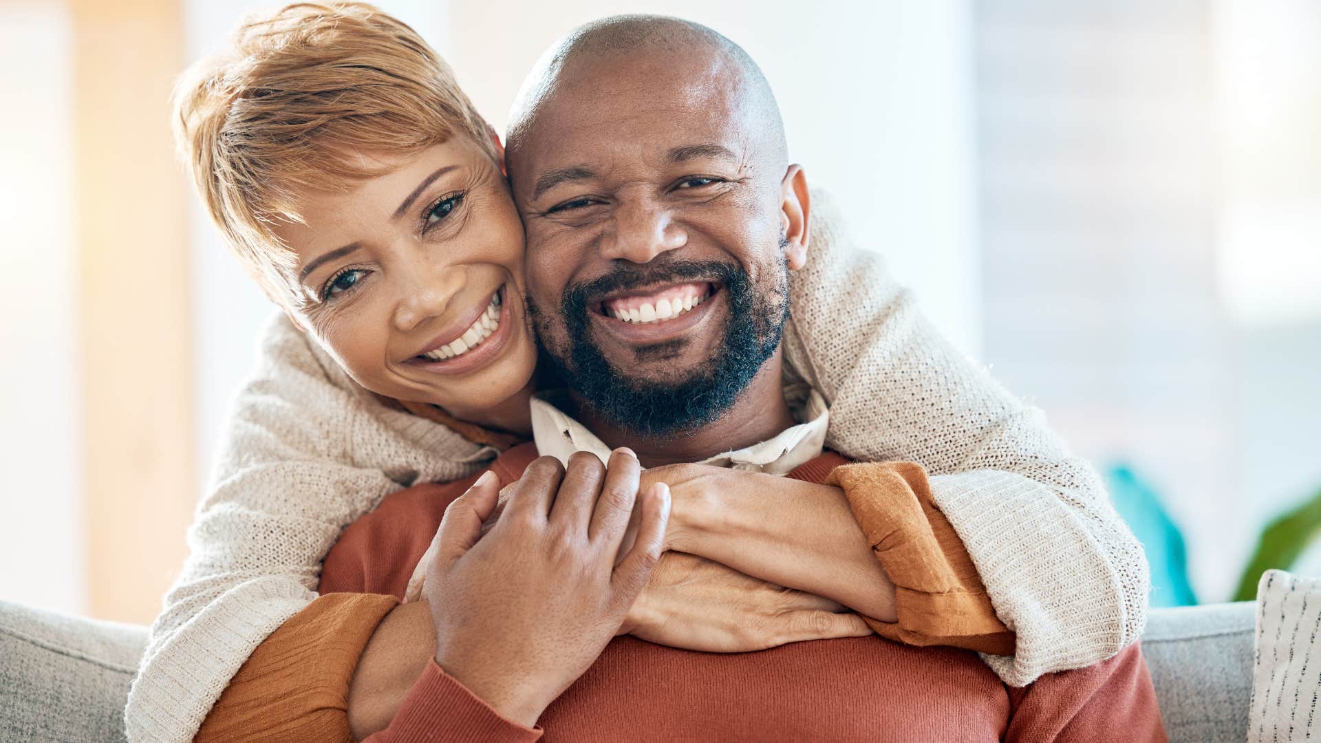 couple loving each other out loud smiling and hugging