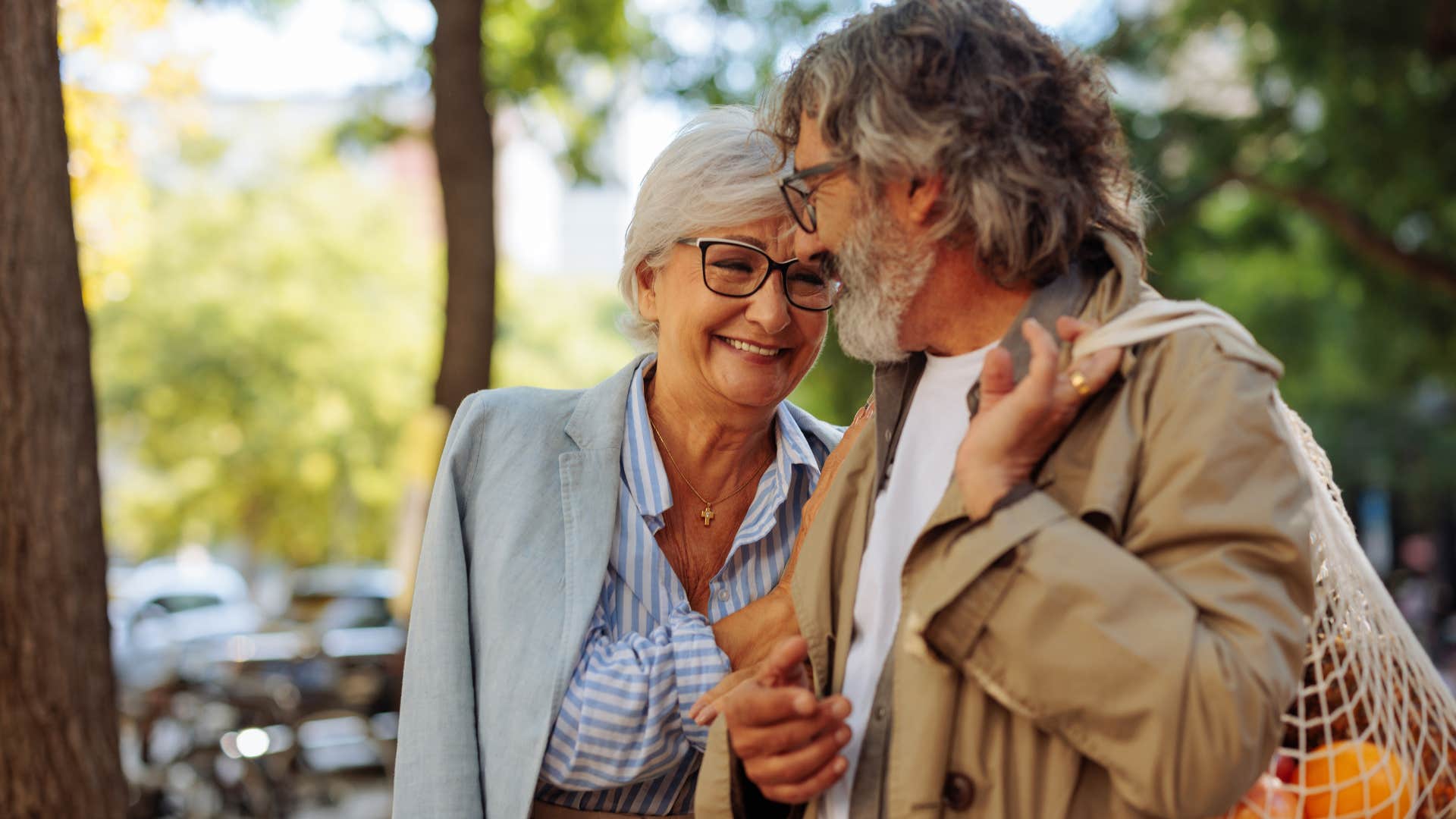 man speaking kindly to his wife walking outside