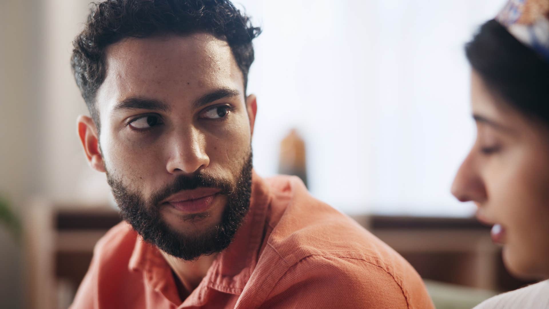 upset man telling his partner not to worry