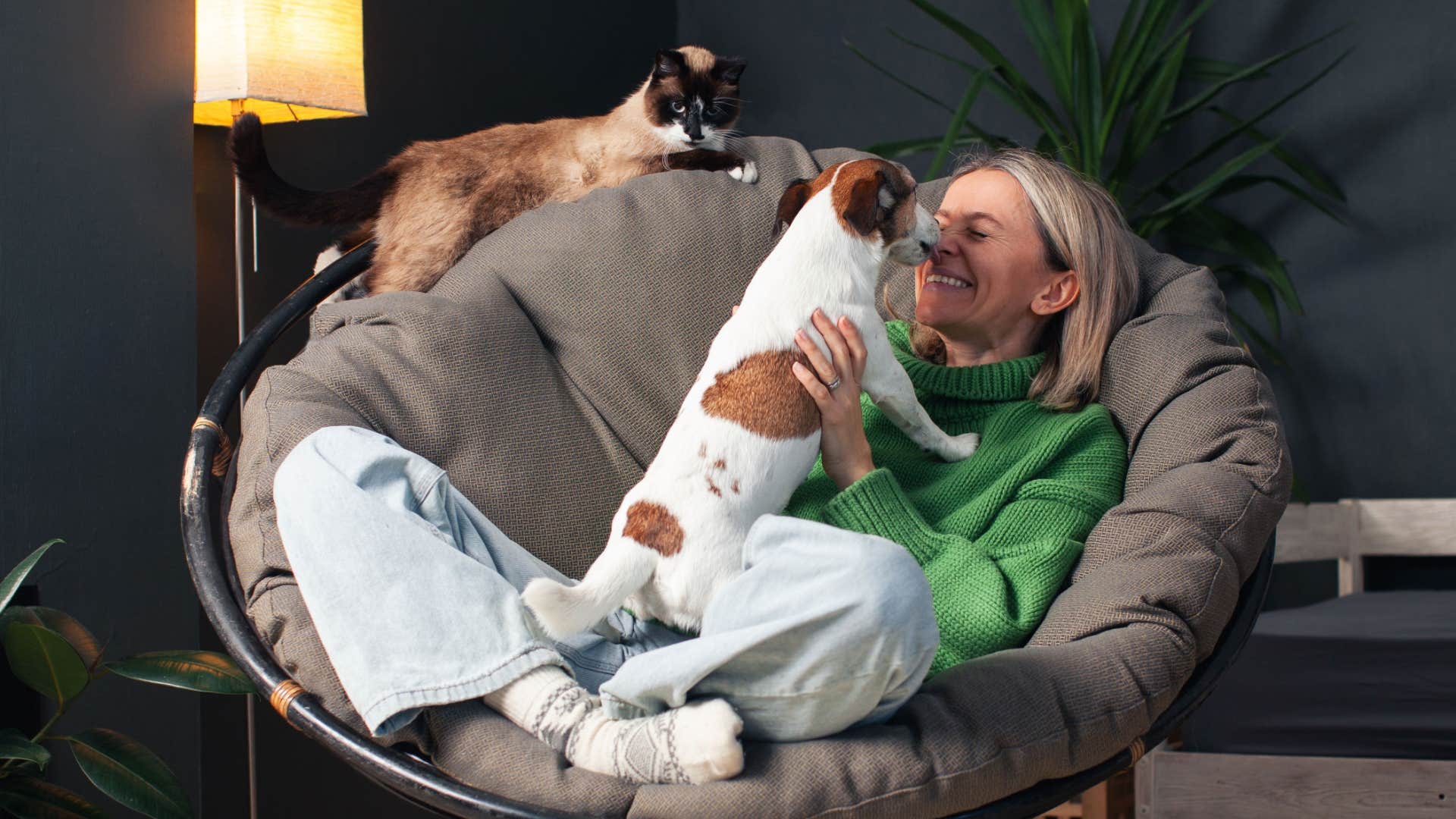 woman with cats with a naturally calming presence