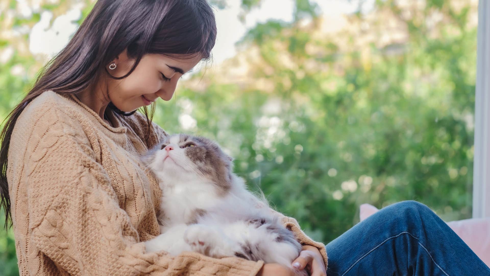 woman who radiates stillness with cat