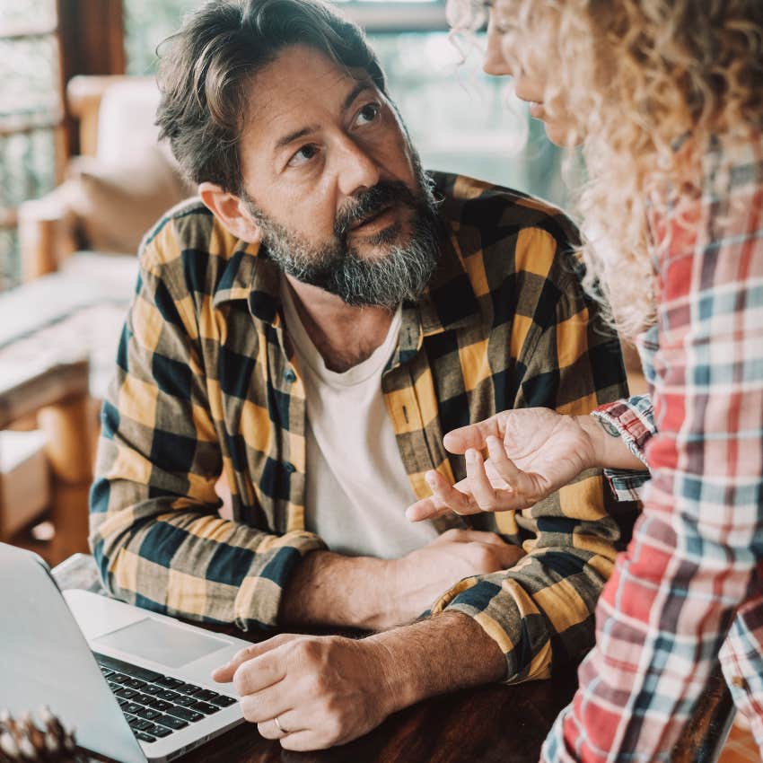 man saying he will be home late talking to his wife