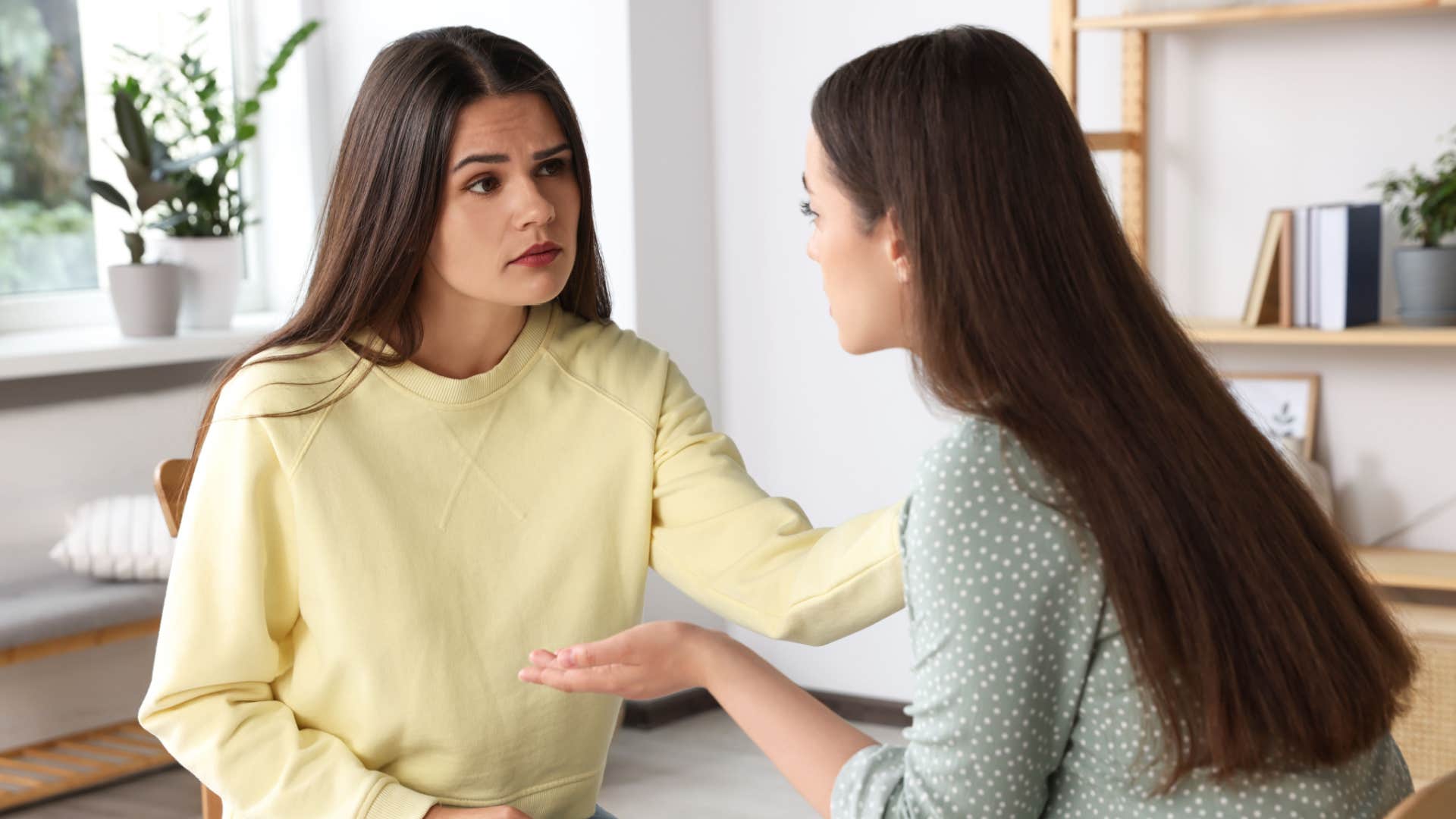 woman telling her friend shes being dramatic