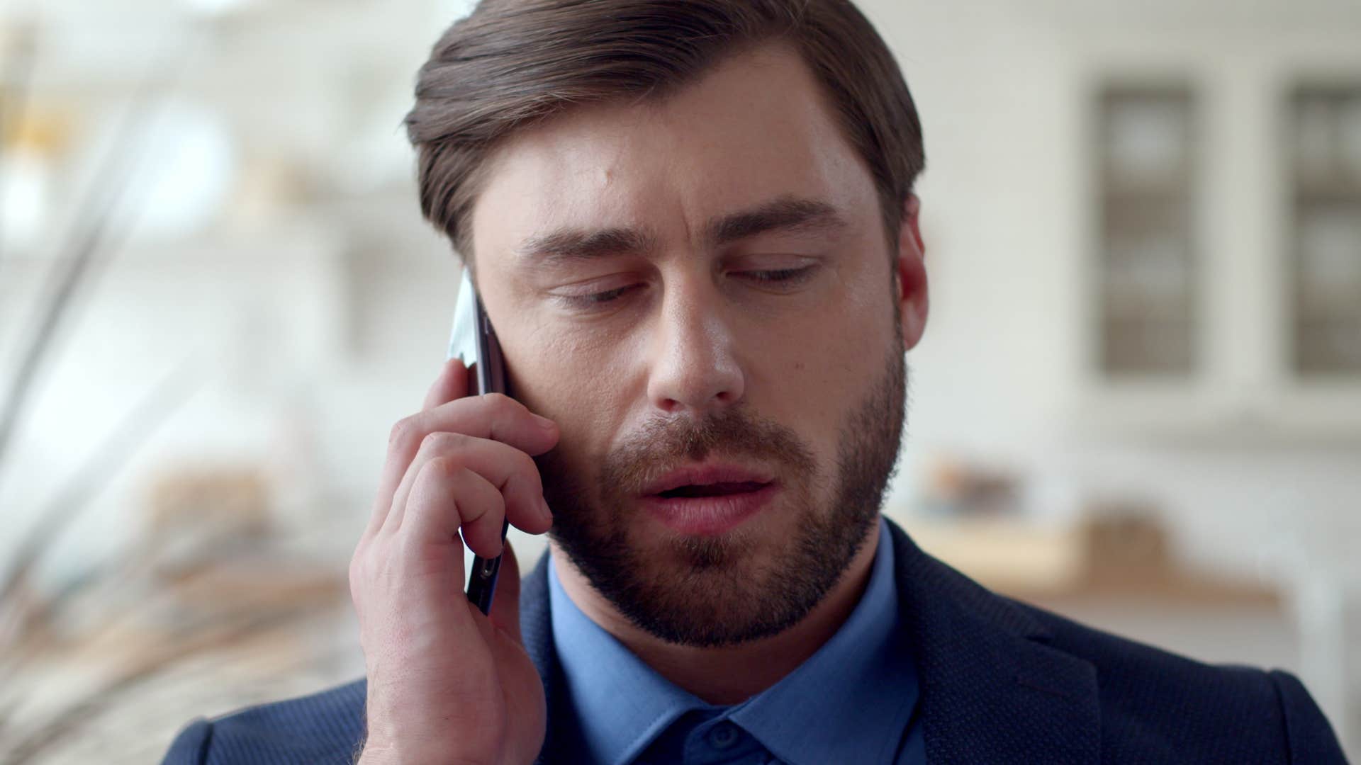 defensive man on the phone feeling like hes not enough