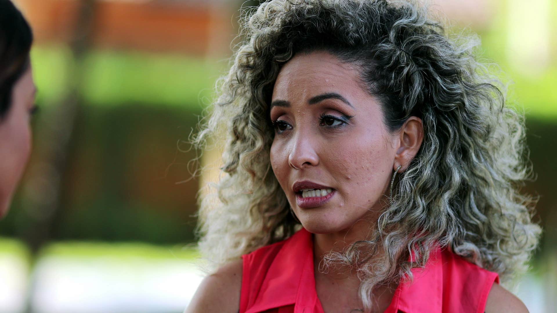 upset woman telling friend you owe me