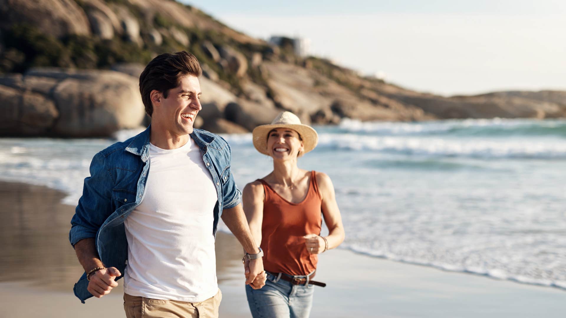 couple walking together on the beach in magical moment