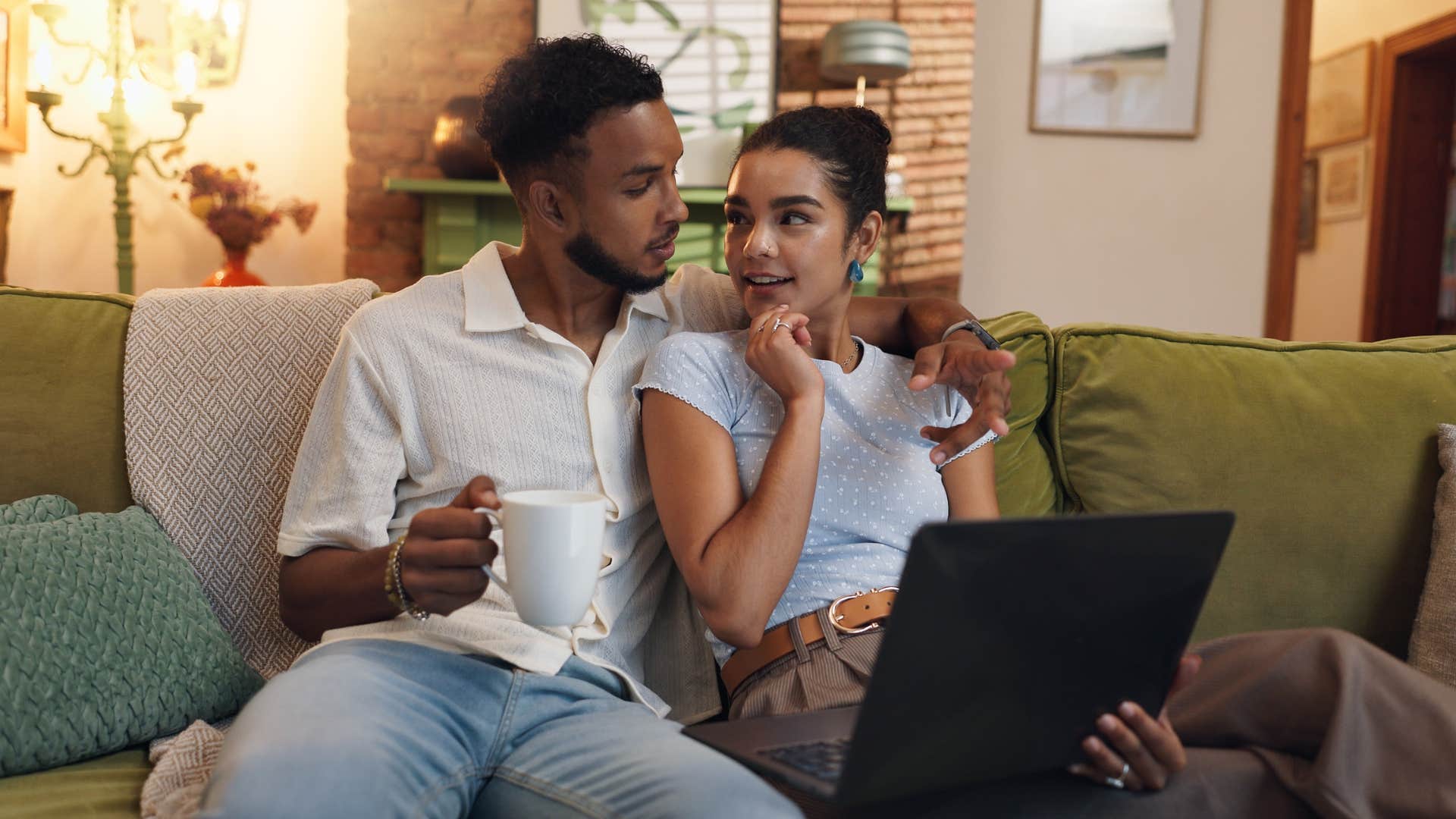 couple sitting on couch inspiring each other