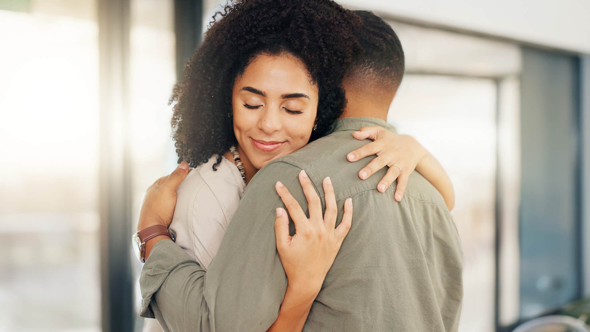 woman hugging her husband in her safe space