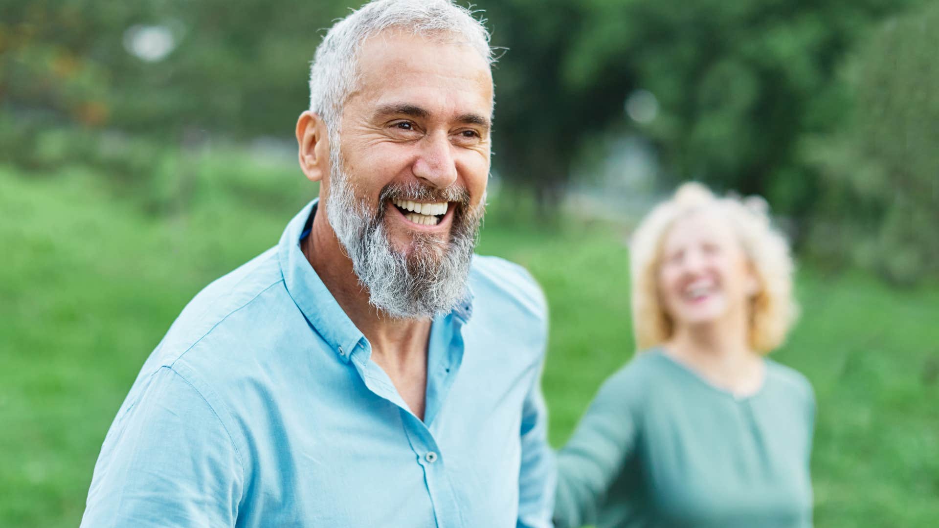 man making space for his wife's voice smiling outside