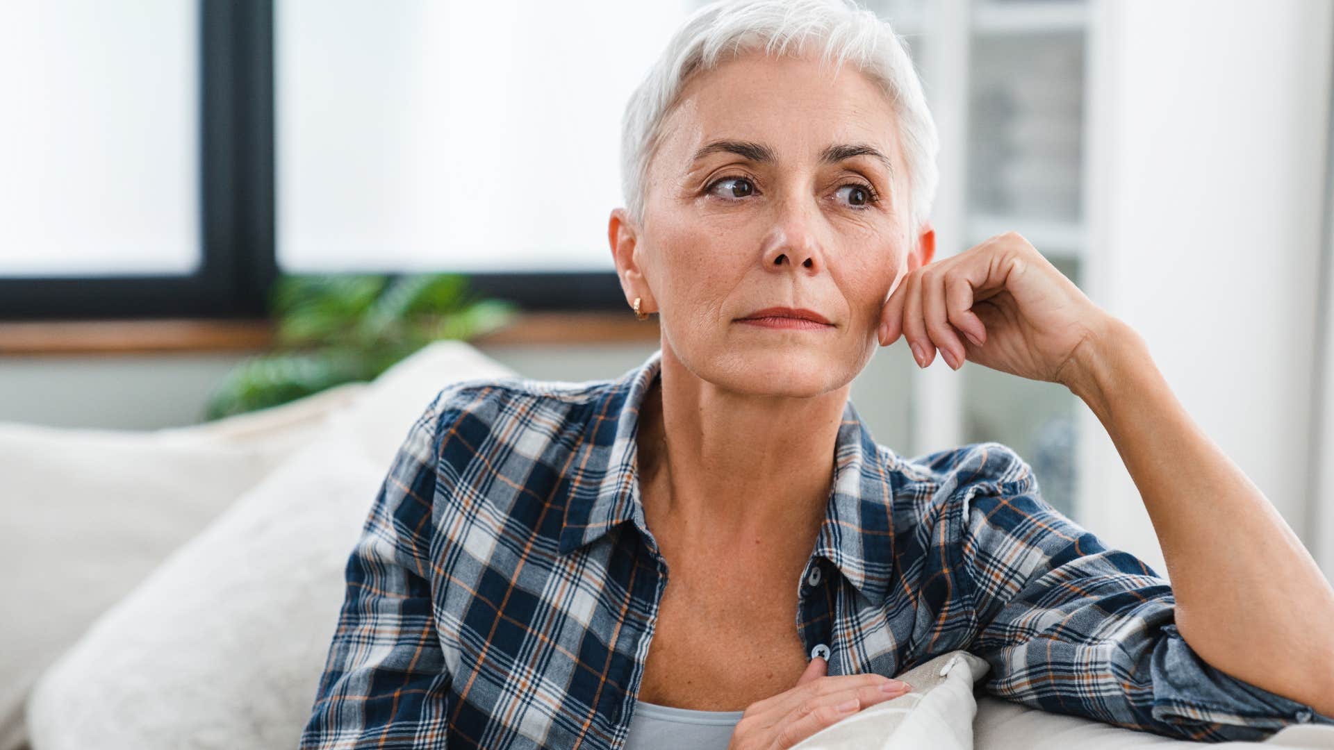 Woman who's incredibly private sitting at home.
