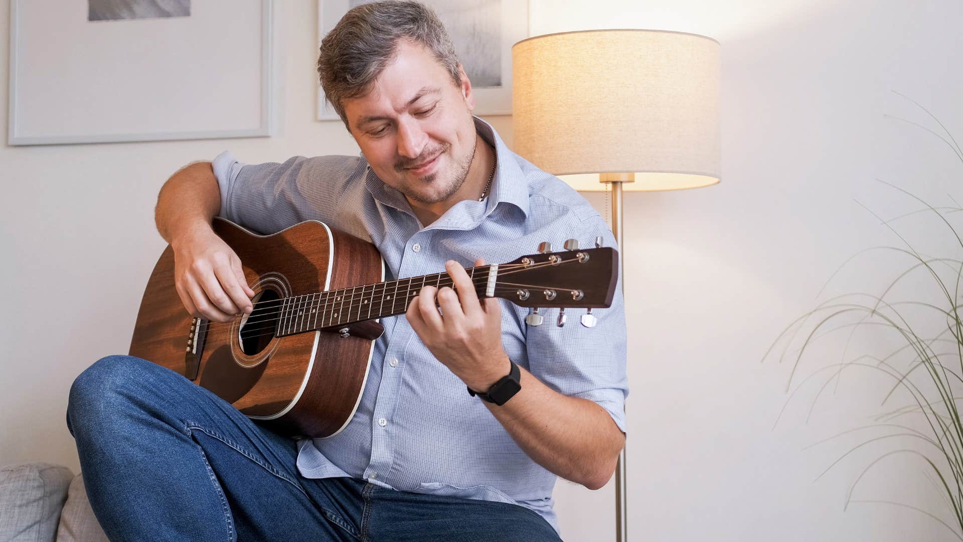 man who's found other hobbies to indulge in playing guitar