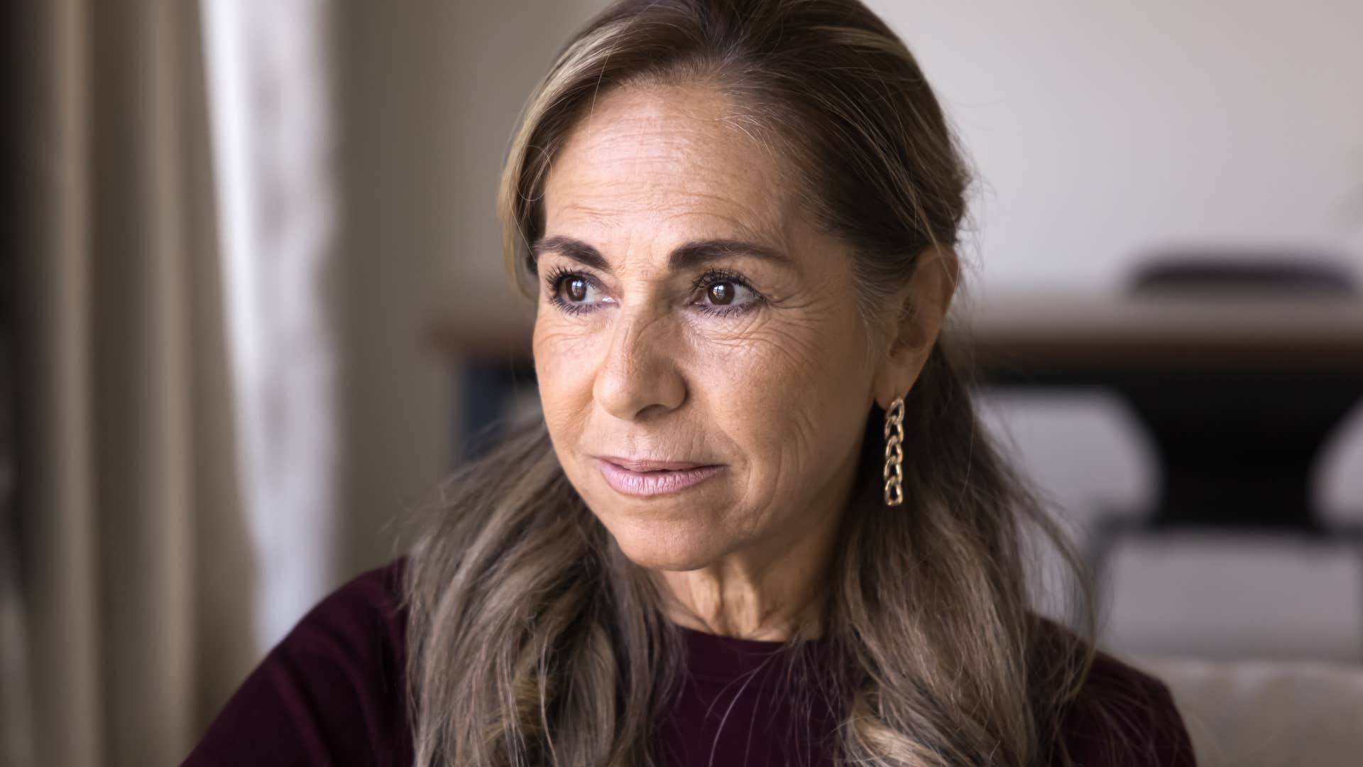 woman experiencing a major life change looking sad