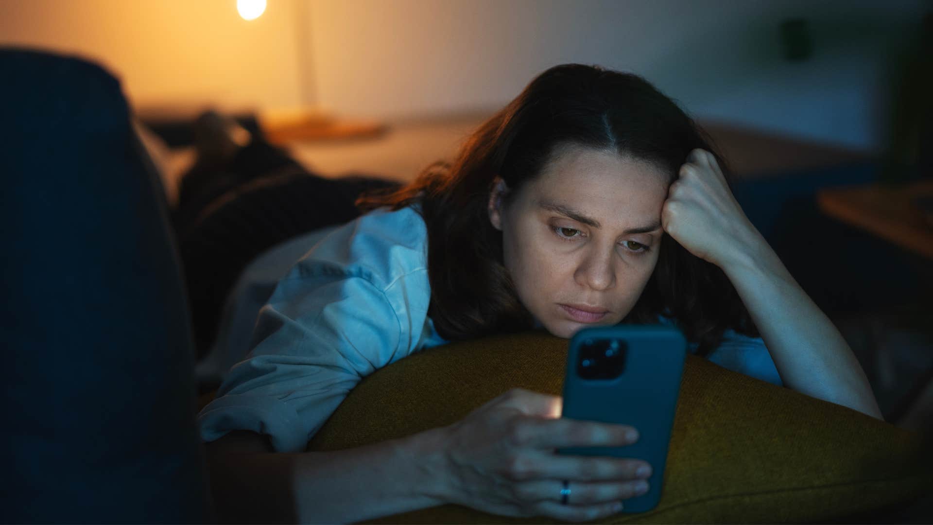 woman busy consuming content on her phone