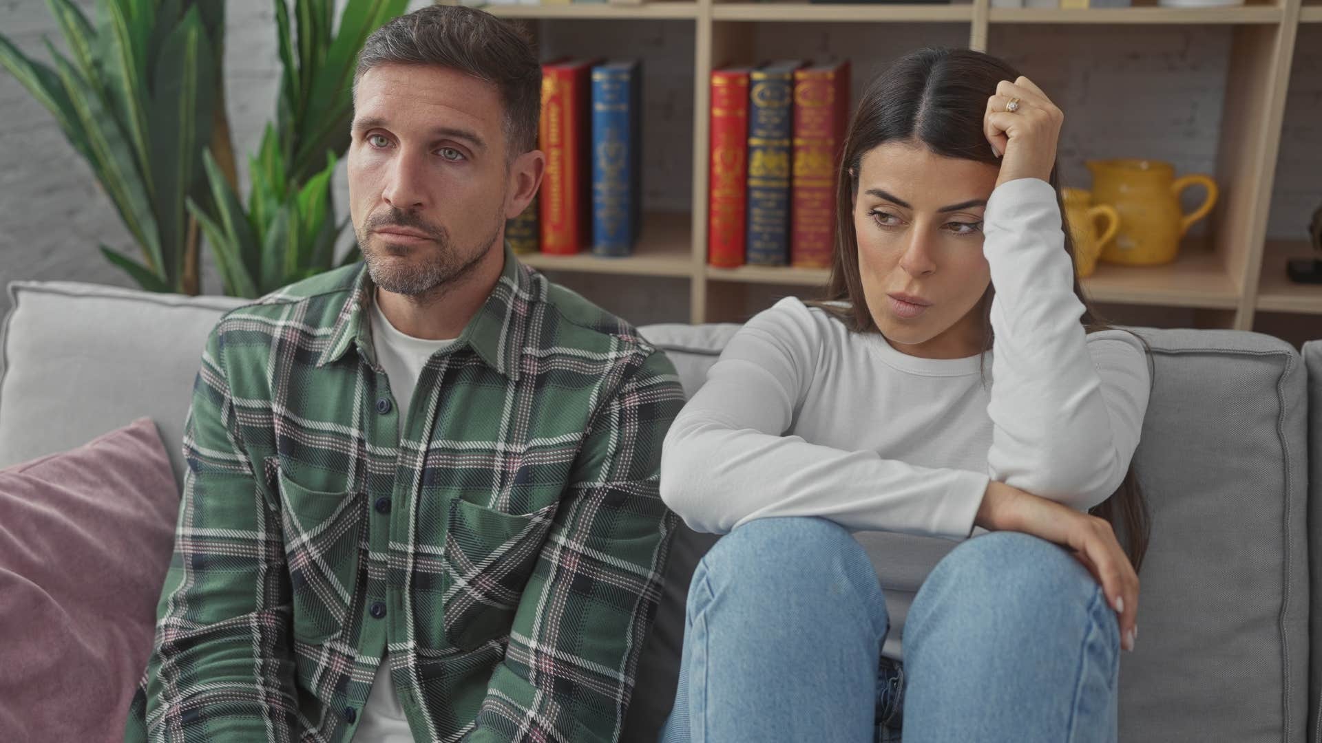 distant couple always negotiating sitting on the couch