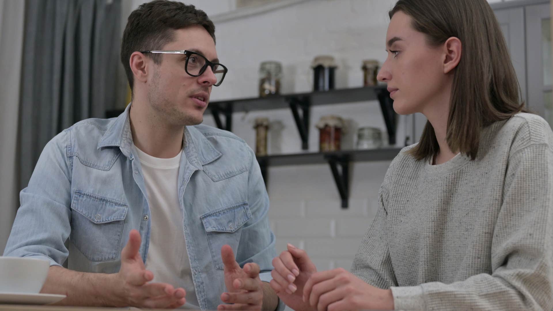 couple who has to schedule intimacy talking at home