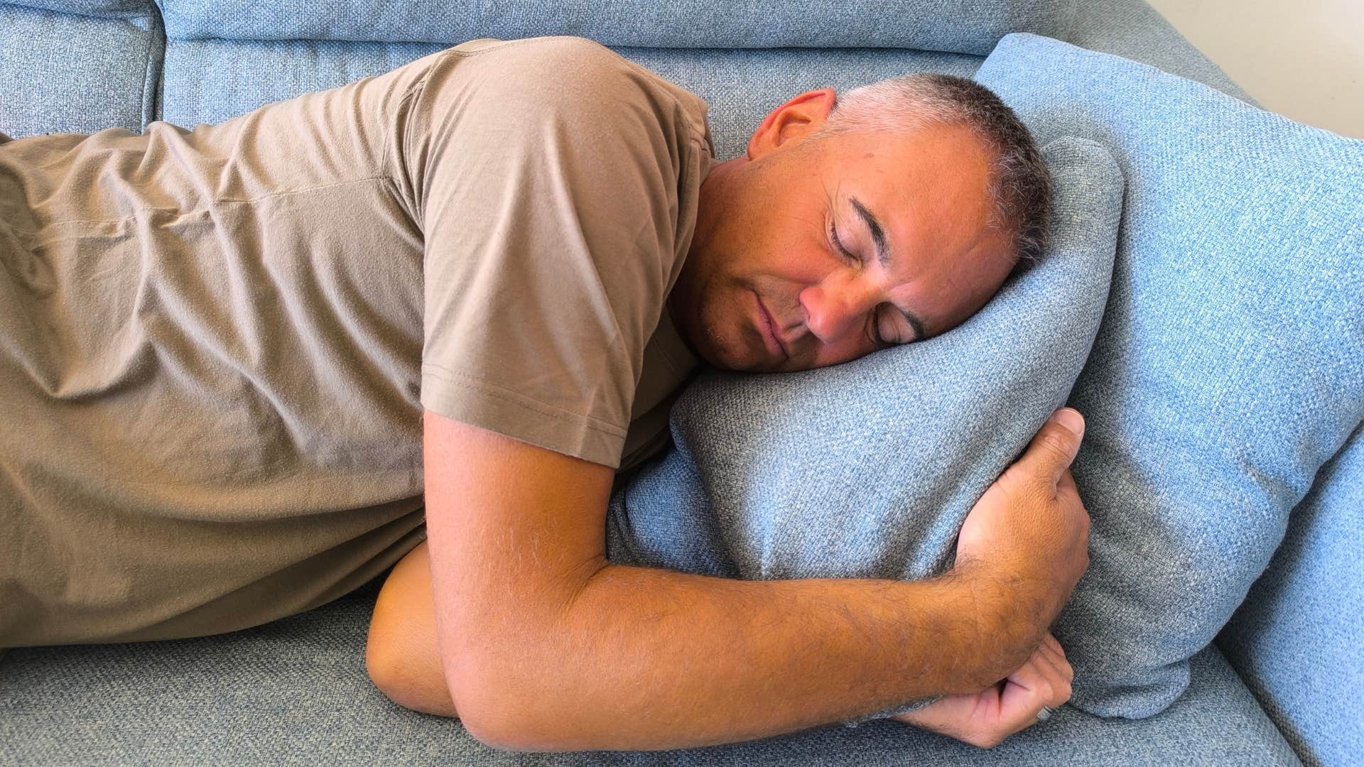 giving man laying on the couch