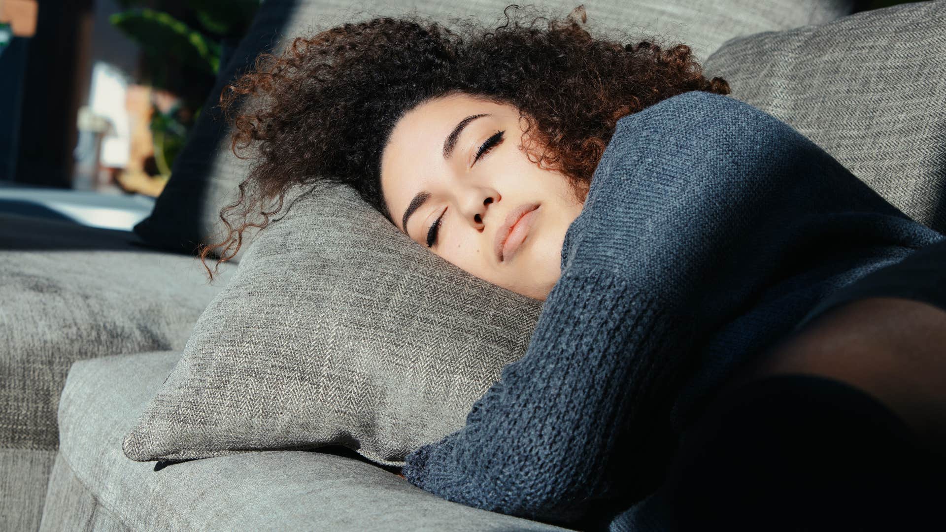 woman self-soothing cuddling pillow