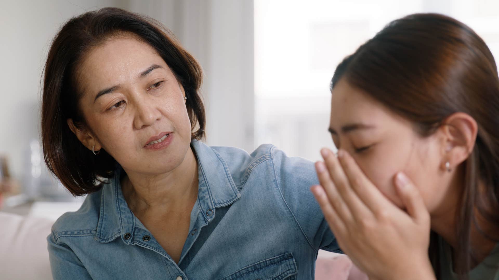 mother saying you're wasting time to her upset daughter