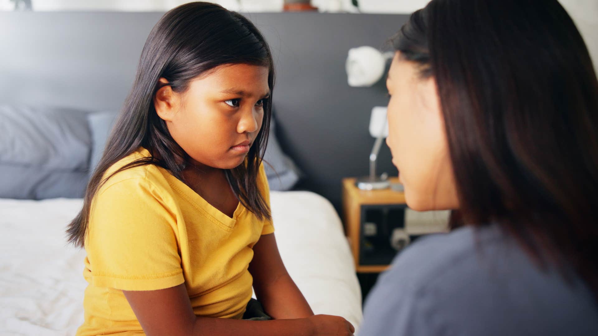 mom telling frustrated daughter some people have a lot less than we do