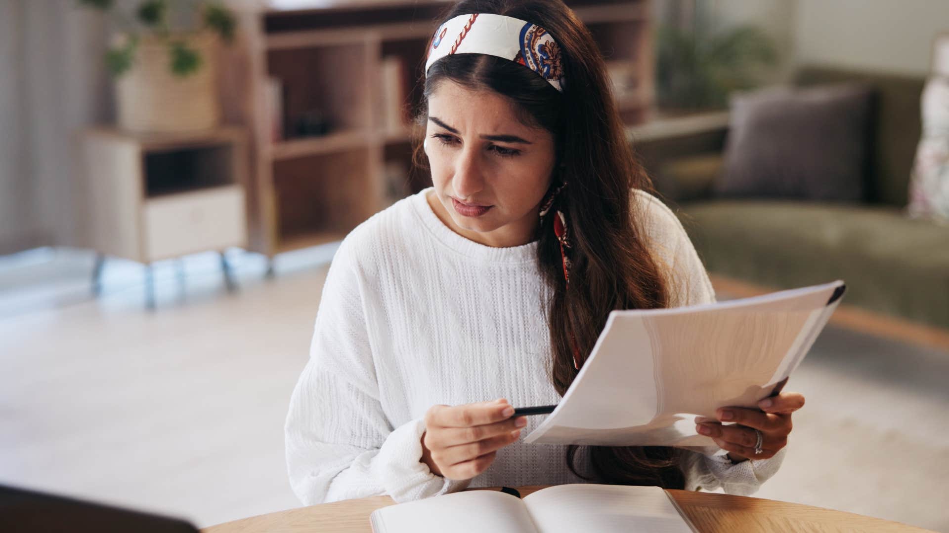 Woman working on half-finished clean-up projects at home.