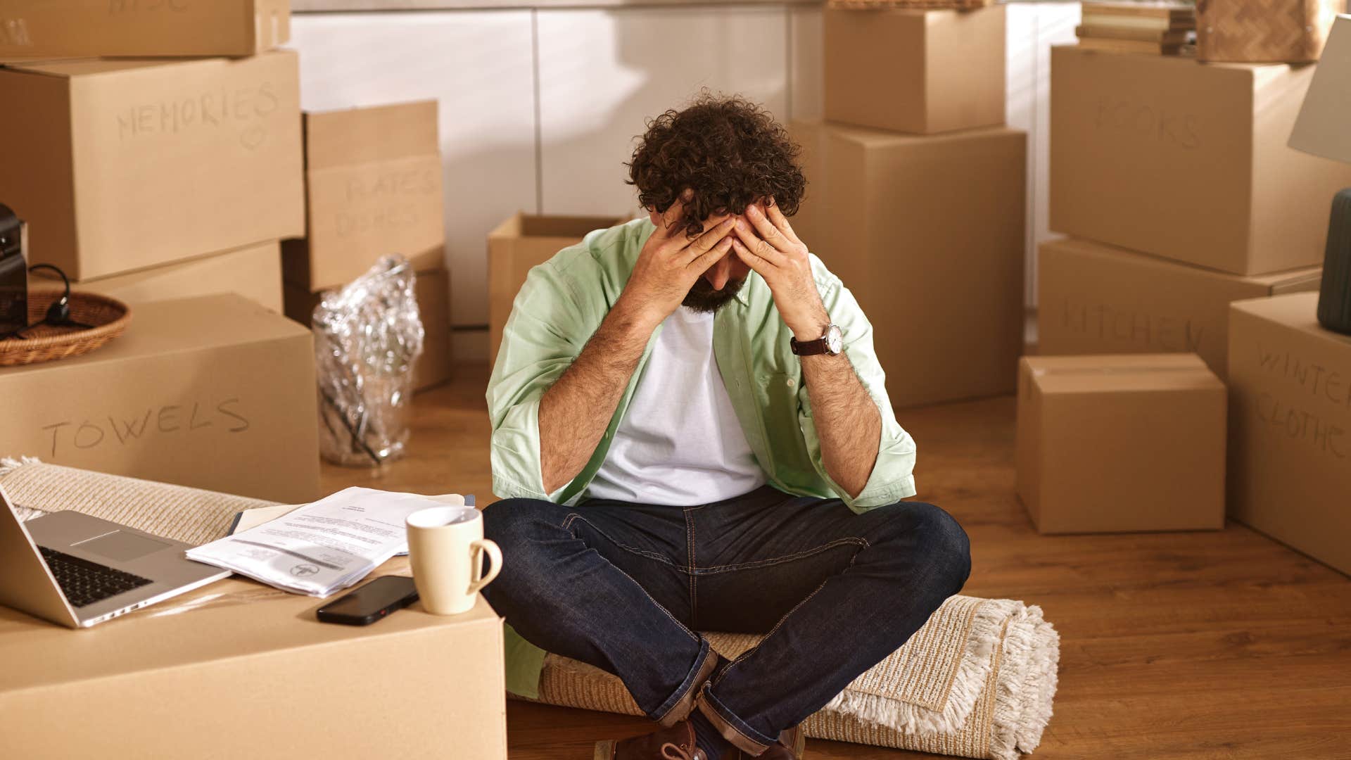 Man sitting around abandoned projects at home.