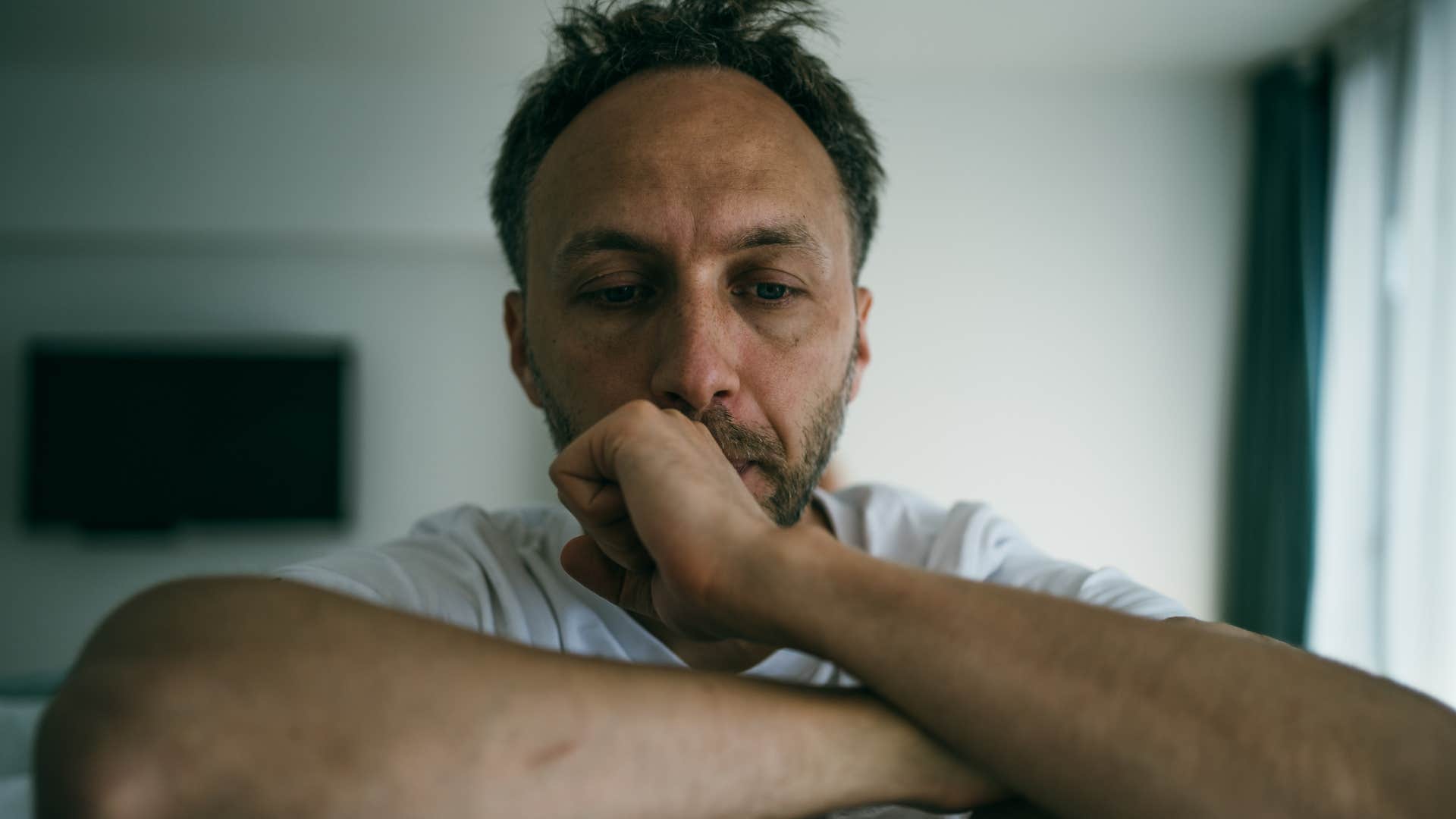 stressed man looking upset at home