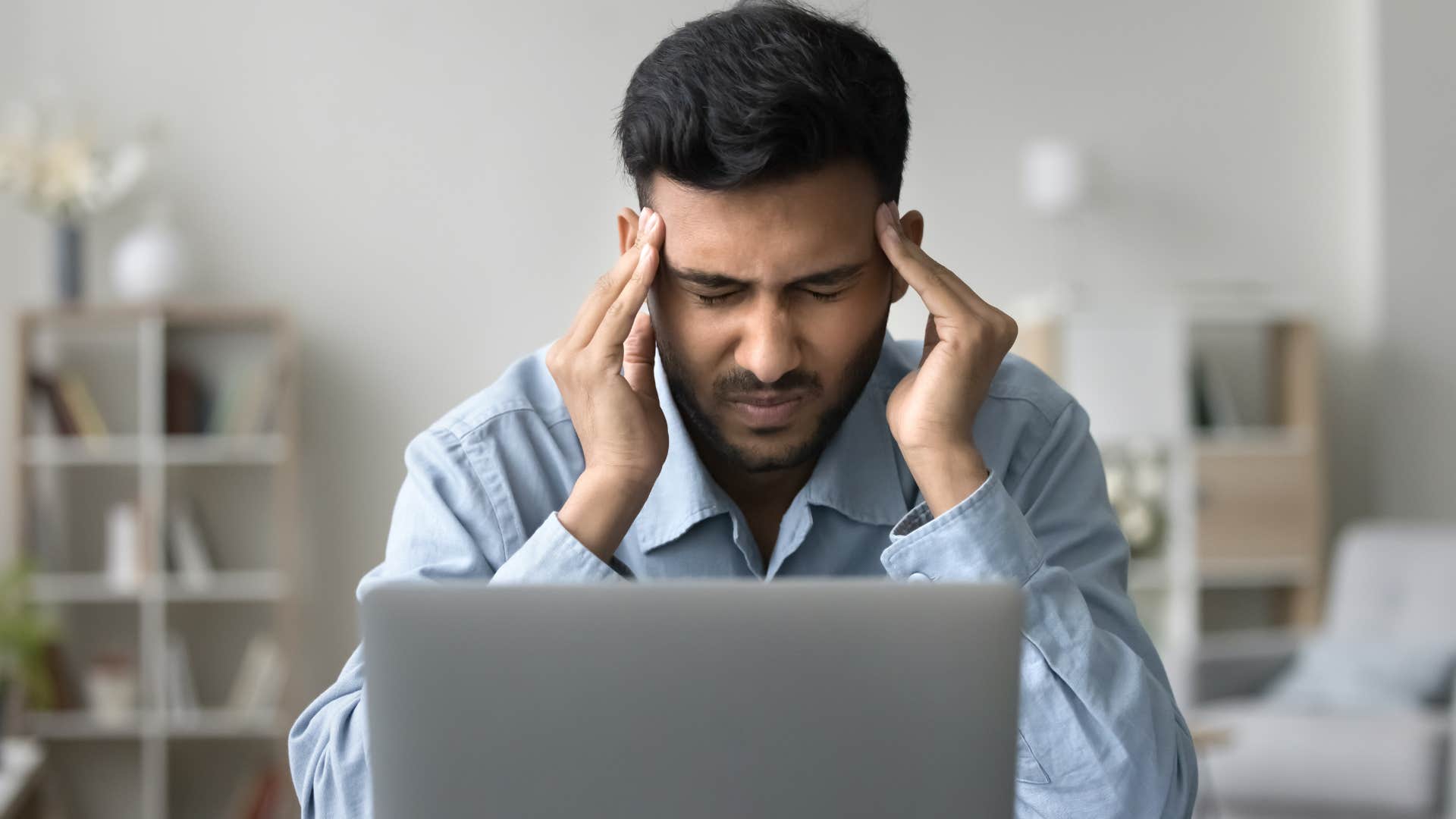 stressed man with a headache