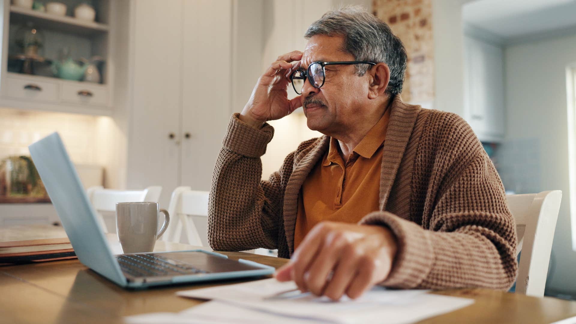 man working at his desk at home