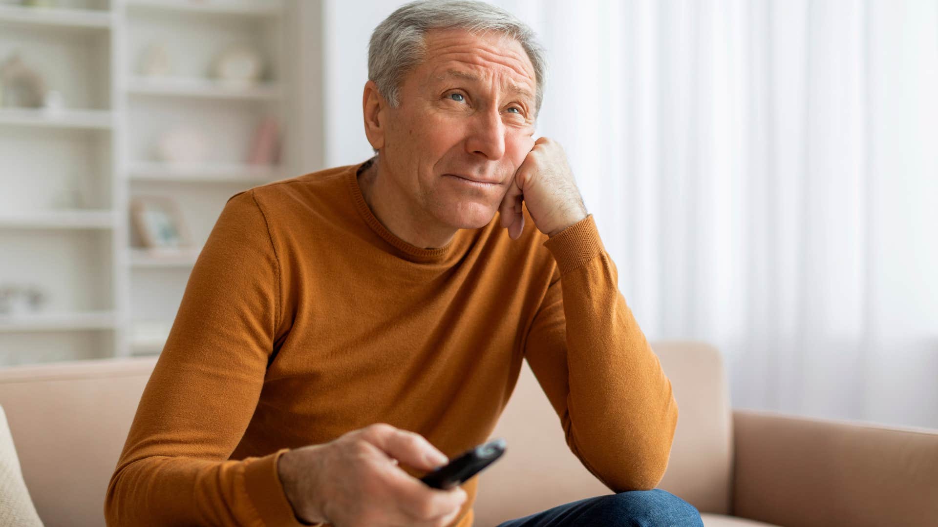 older man whose TV is always on at home
