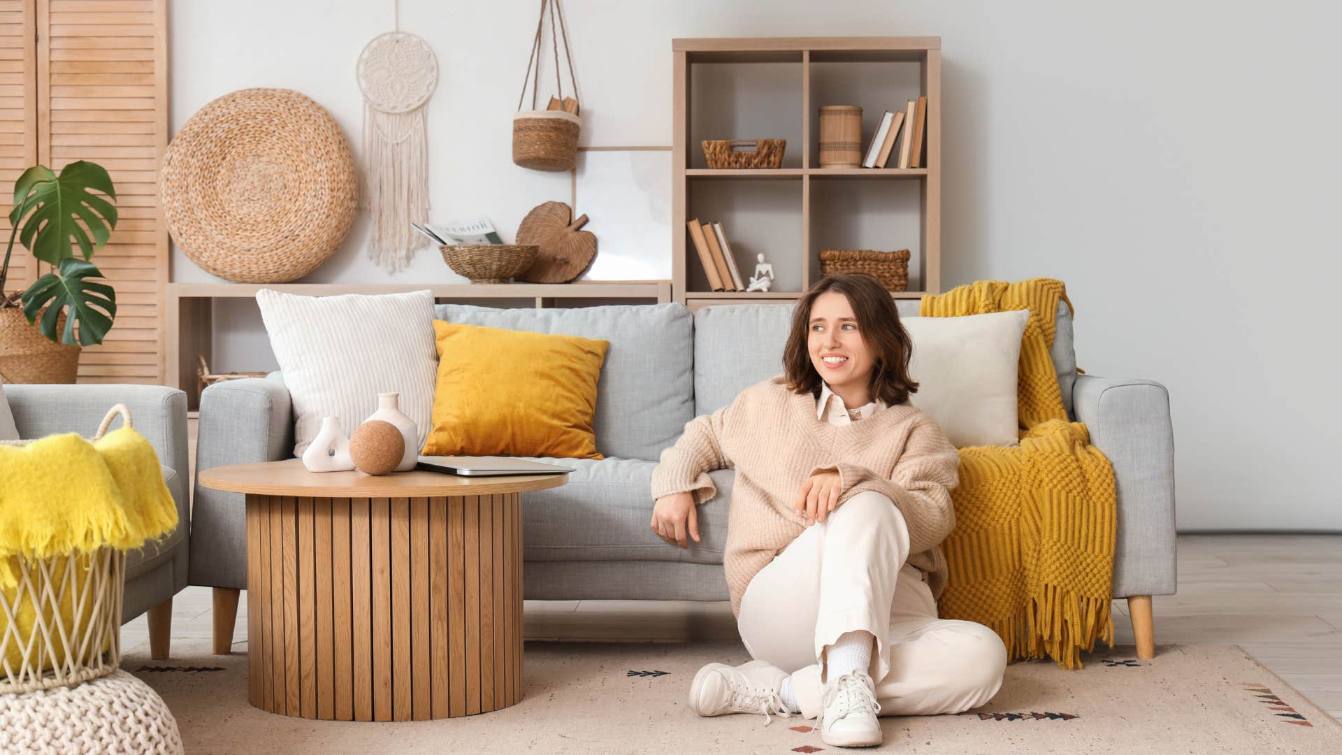 homebody woman sitting on the floor of her living room