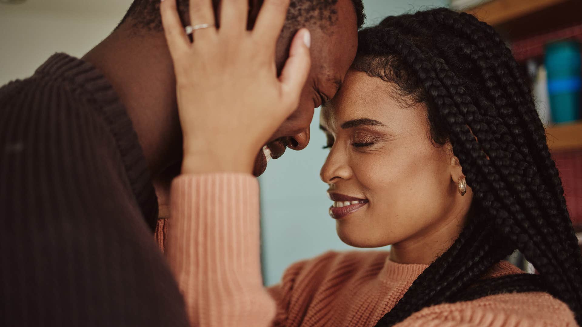 Man saying "I'm so proud of you" and hugging his wife.
