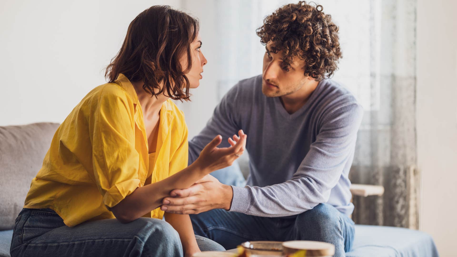 Man saying "I've got you" to his upset wife.