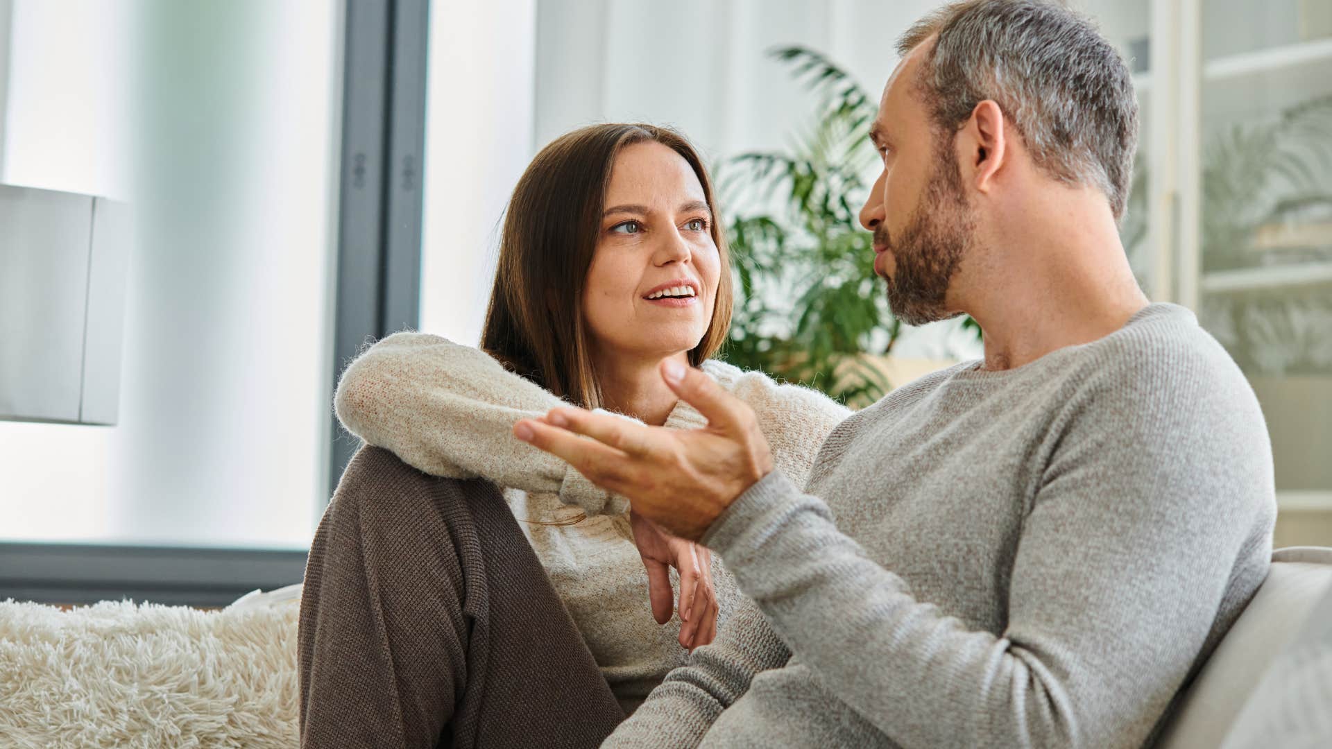 Man saying "What's going on?" to his wife at home. 