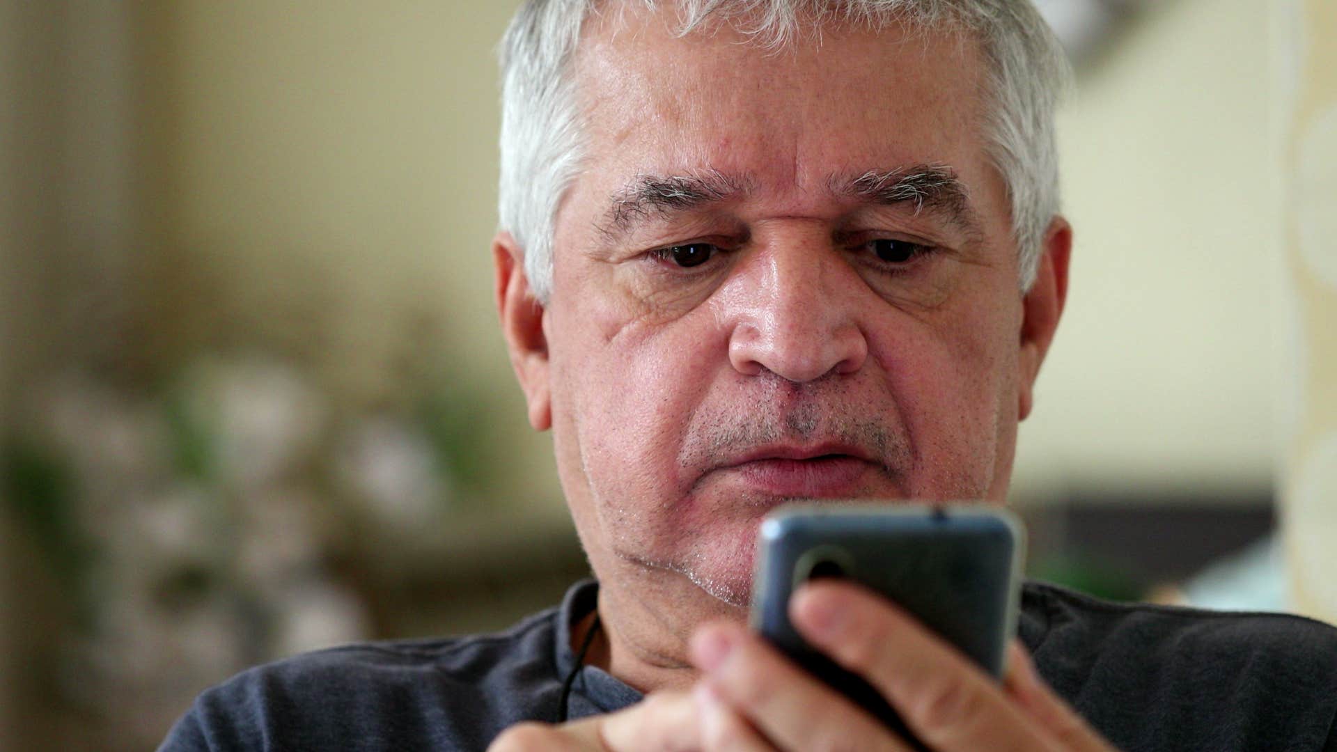 lonely older man texting kids about being busy