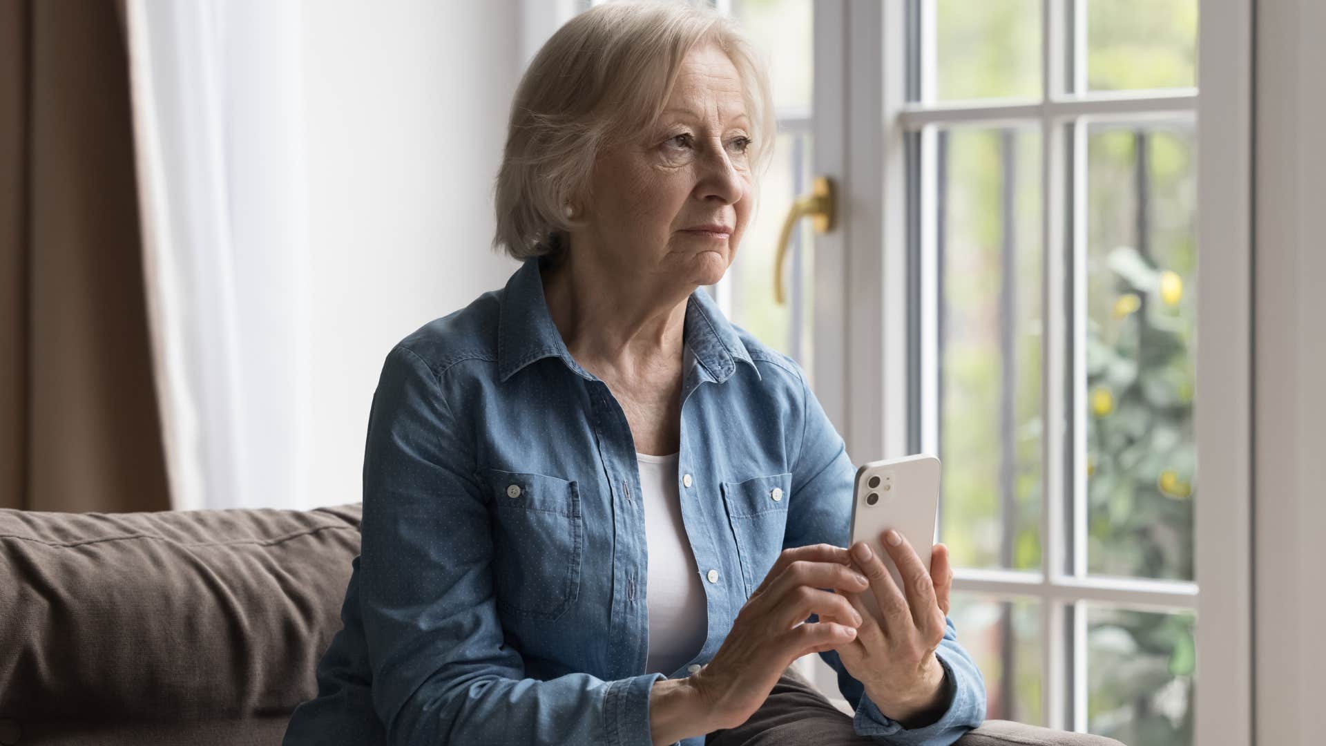older lonely woman who's always on her phone